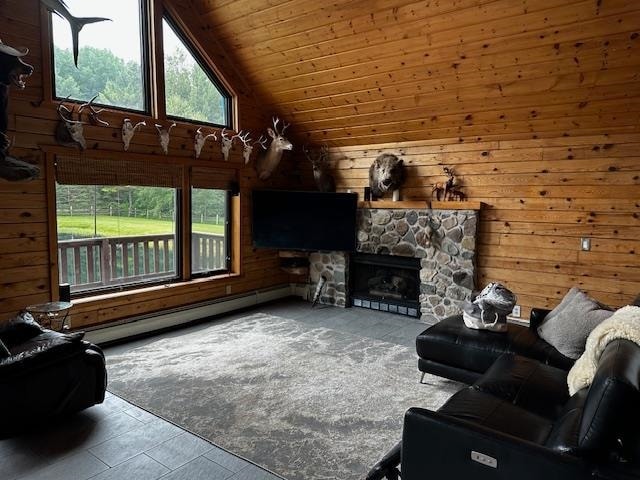 living room with wood ceiling, a baseboard heating unit, vaulted ceiling, and a wealth of natural light