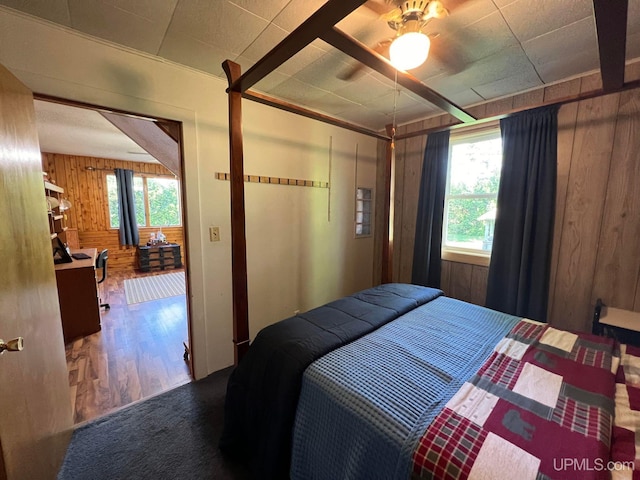 bedroom with wooden walls