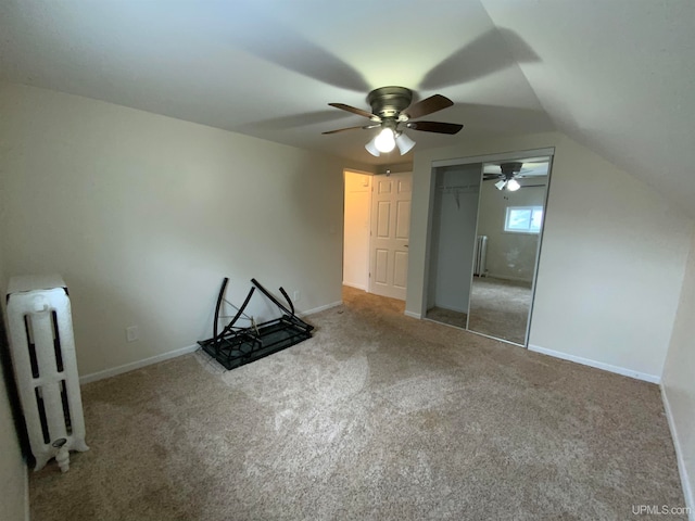 additional living space with lofted ceiling, carpet, and ceiling fan