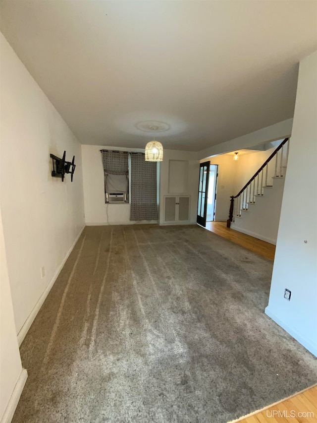 unfurnished living room with carpet floors