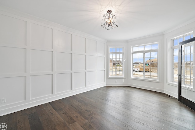 unfurnished sunroom with a chandelier