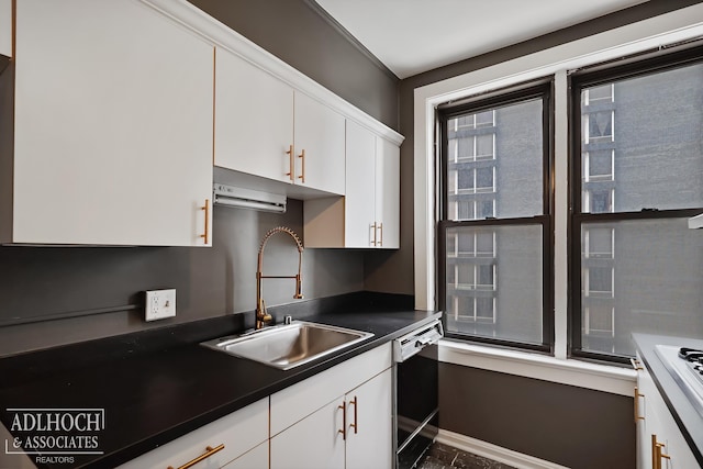 kitchen with black dishwasher, sink, and white cabinetry