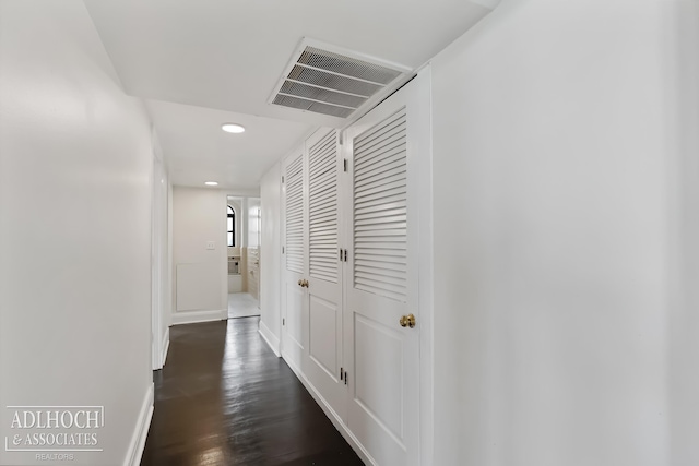 hall with dark hardwood / wood-style floors