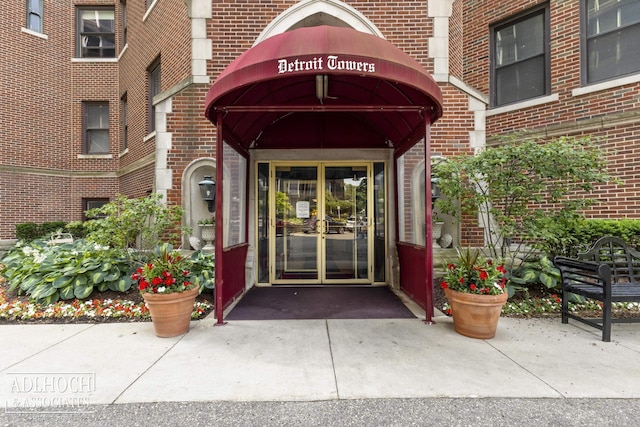 property entrance featuring brick siding