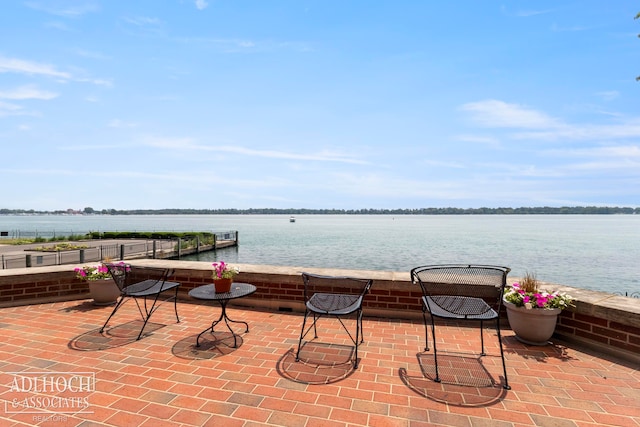 view of terrace featuring a water view