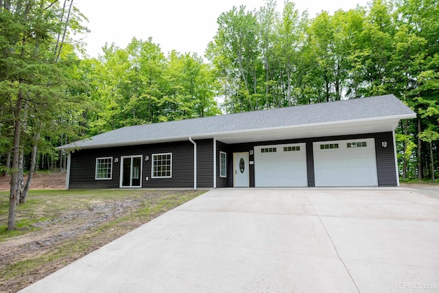 ranch-style house featuring a garage