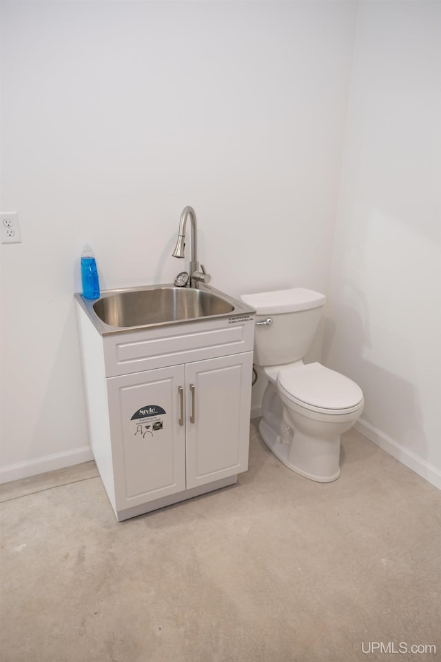 bathroom with sink and toilet