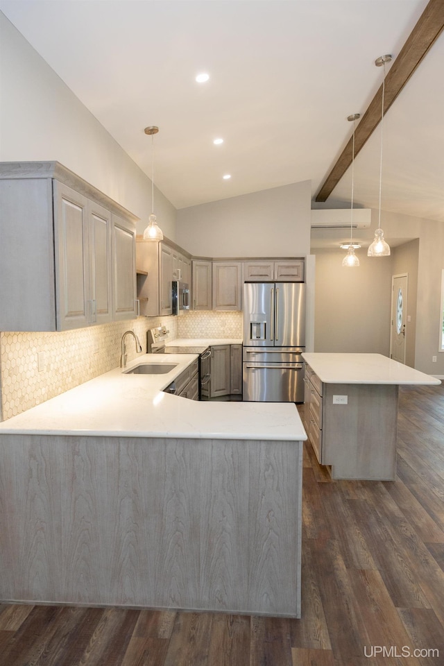 kitchen featuring vaulted ceiling with beams, appliances with stainless steel finishes, dark hardwood / wood-style flooring, and tasteful backsplash