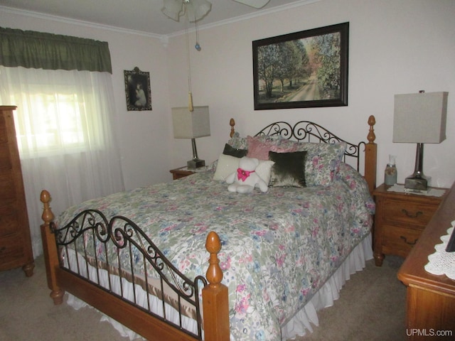 carpeted bedroom with crown molding