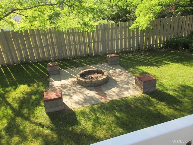 view of yard featuring a patio and a fire pit