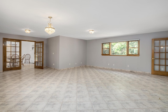 empty room featuring french doors