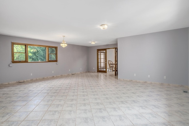 empty room featuring french doors