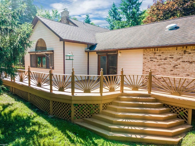 back of house featuring a deck