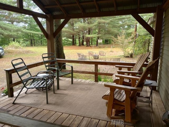 wooden terrace featuring a yard