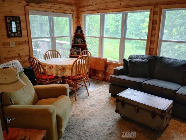 dining room featuring wood walls