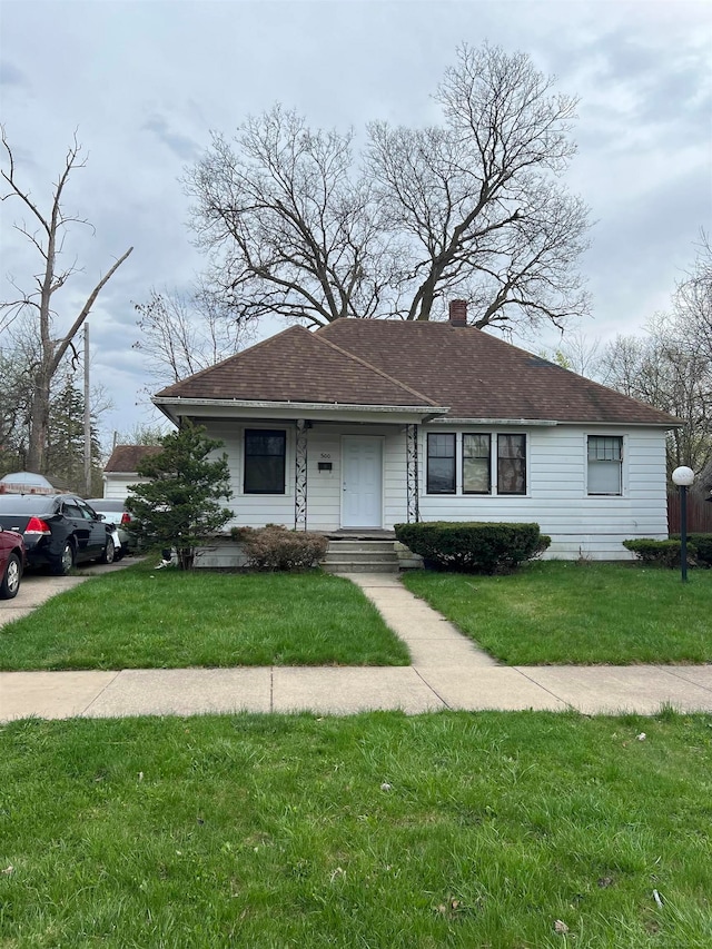 view of front of home with a front yard