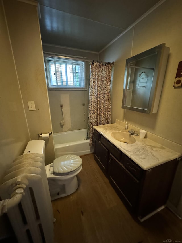 full bath featuring shower / bathtub combination with curtain, toilet, radiator heating unit, vanity, and wood finished floors