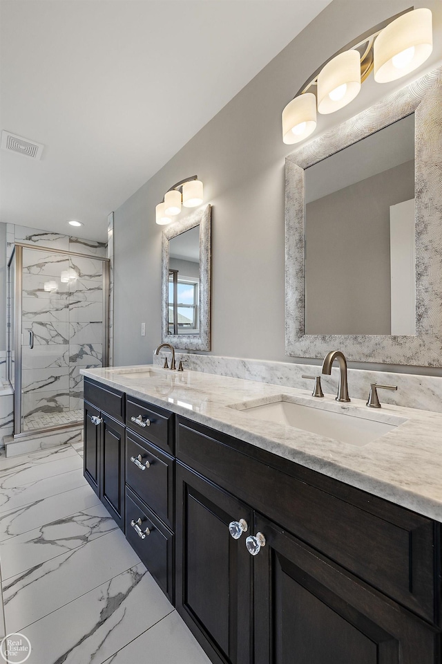 bathroom featuring vanity and an enclosed shower