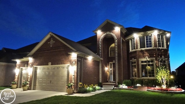 view of front facade featuring a garage and a lawn