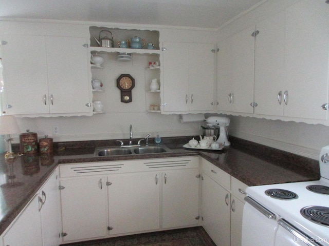 kitchen featuring sink, white cabinets, and white electric range oven