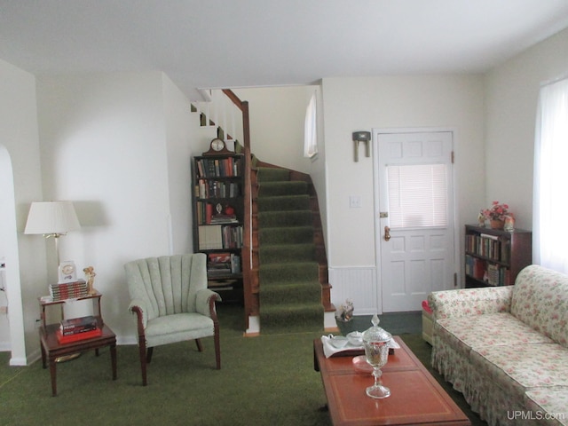 living room featuring carpet floors and a wealth of natural light