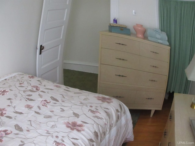 bedroom featuring hardwood / wood-style flooring