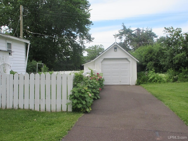 garage with a lawn