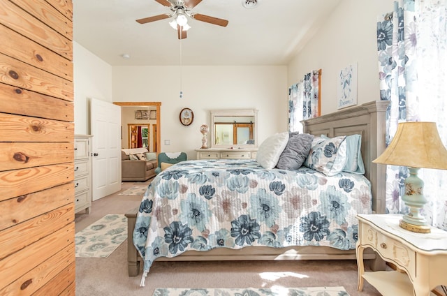 bedroom with ceiling fan and light carpet