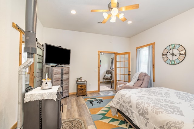 bedroom featuring ceiling fan and light hardwood / wood-style floors