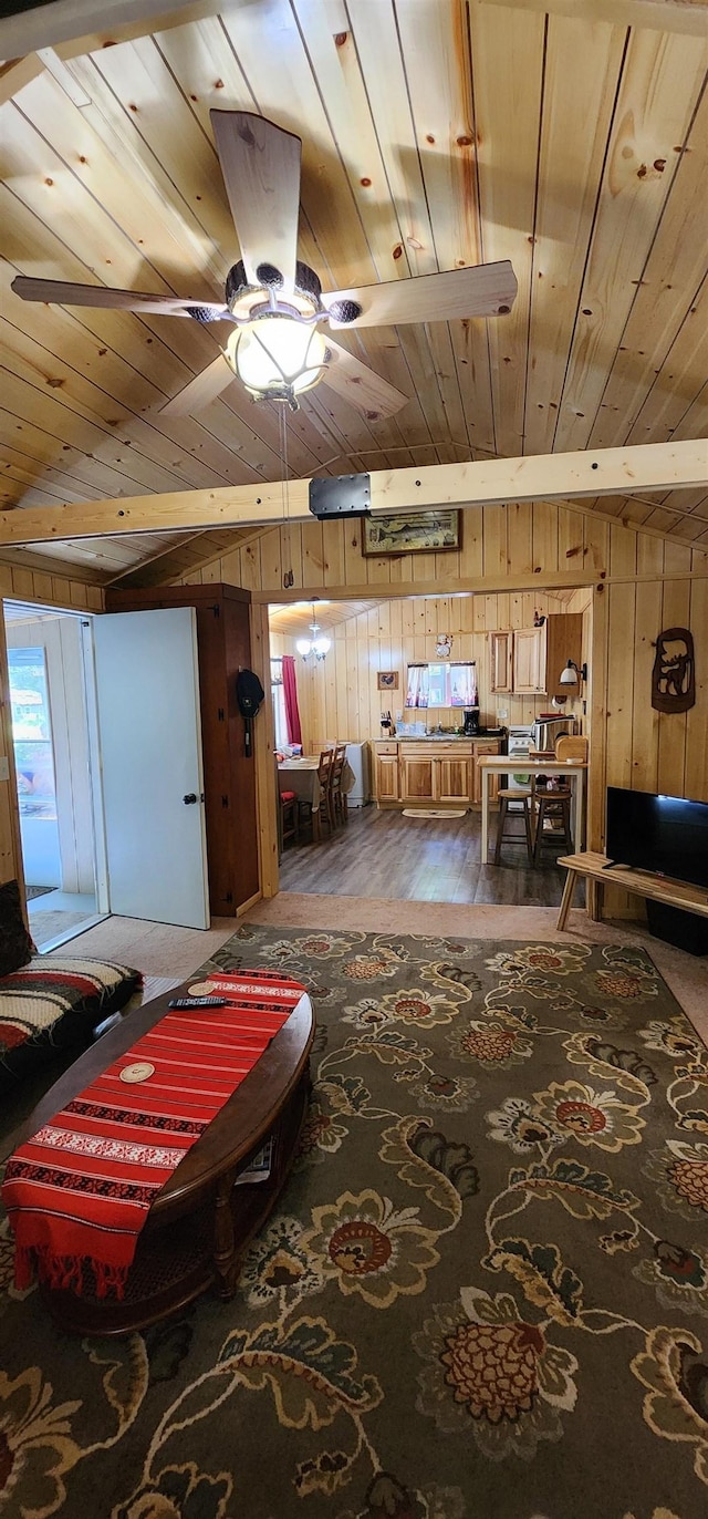 interior space featuring dark hardwood / wood-style floors, ceiling fan, wooden walls, and wood ceiling