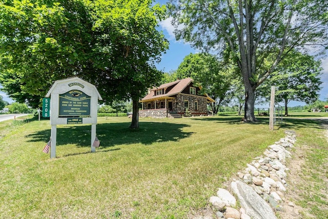 view of community featuring a yard