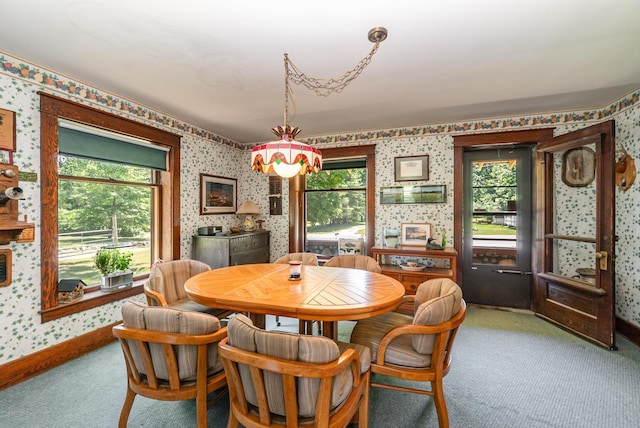 dining space with carpet floors and plenty of natural light