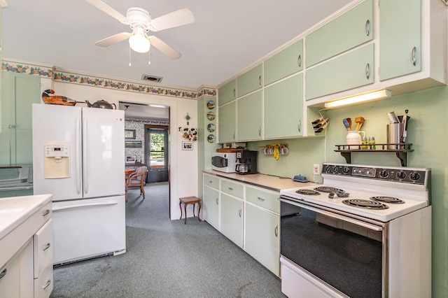 kitchen with white appliances, ceiling fan, and green cabinets