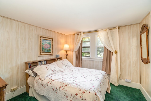 carpeted bedroom with wooden walls