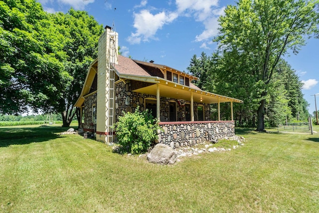 view of side of property featuring a yard