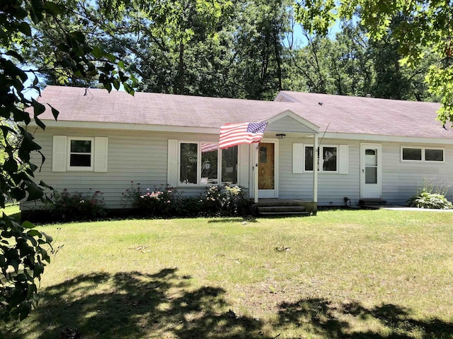 ranch-style house with a front lawn