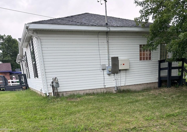 view of side of property with a yard