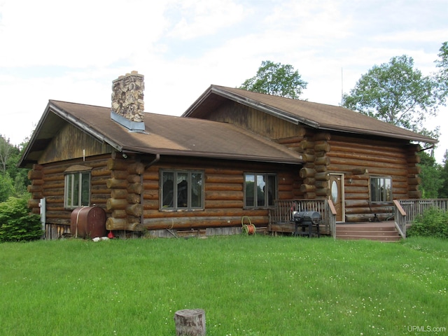 back of house with a yard