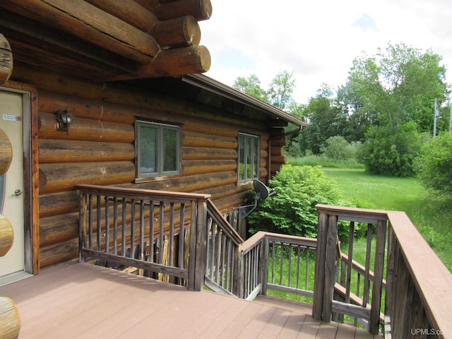 deck featuring a lawn