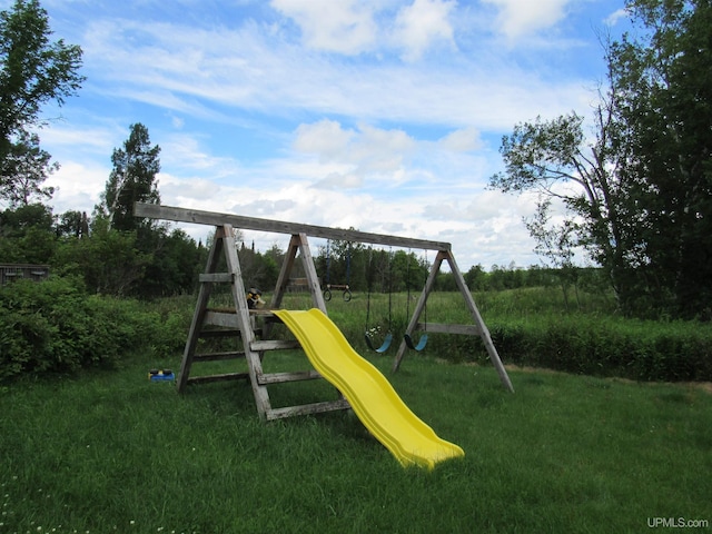 view of playground with a yard