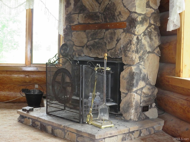 details with a stone fireplace