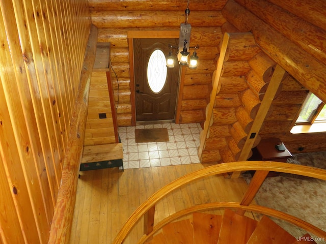 tiled foyer with log walls