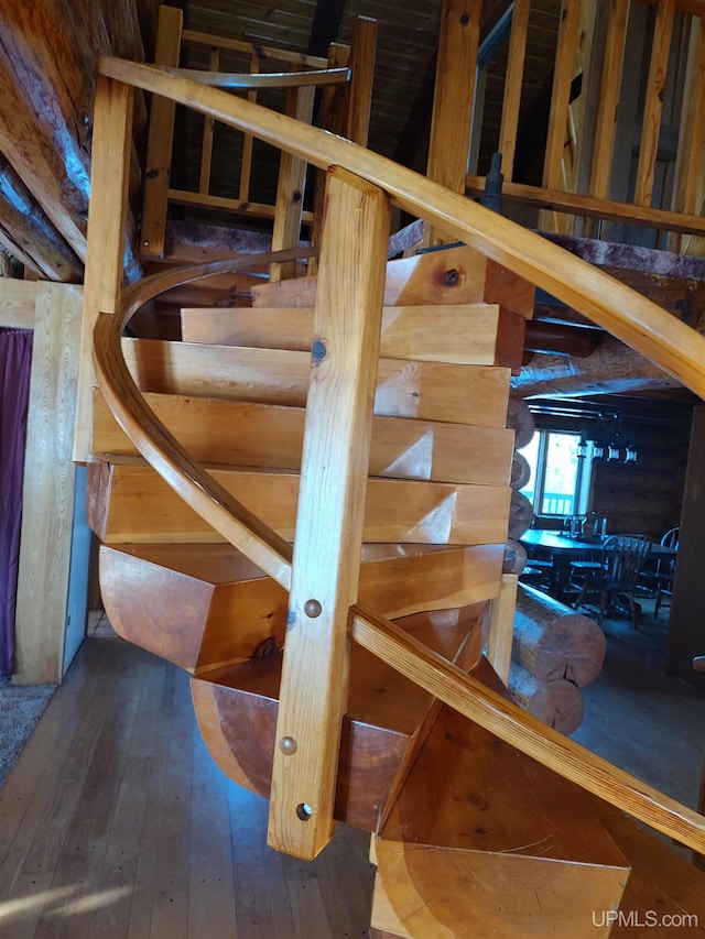 staircase featuring hardwood / wood-style flooring