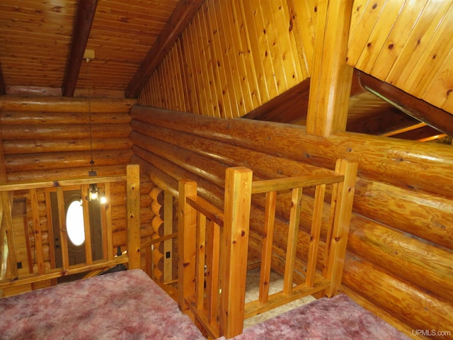 stairs featuring beam ceiling, carpet flooring, wooden ceiling, and rustic walls