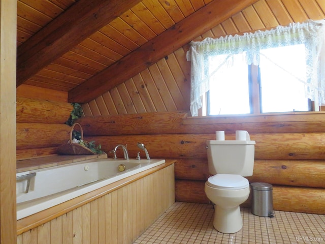 bathroom featuring vaulted ceiling with beams, a bathing tub, tile patterned flooring, and toilet