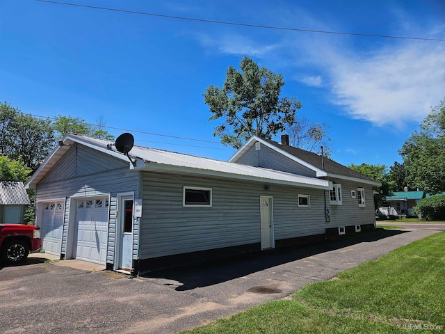 view of side of property with a garage