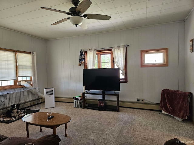 living room featuring carpet, ceiling fan, and baseboard heating