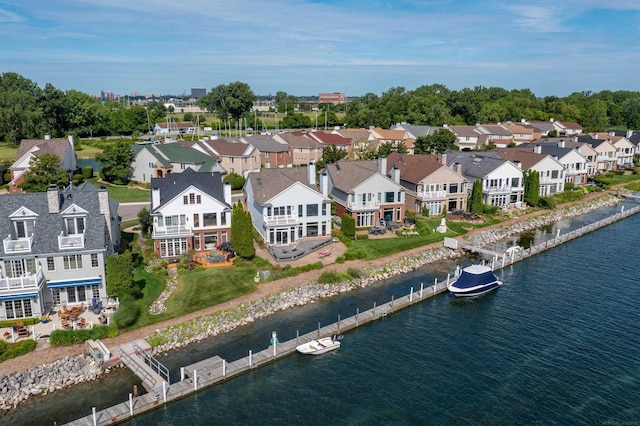 aerial view with a water view and a residential view