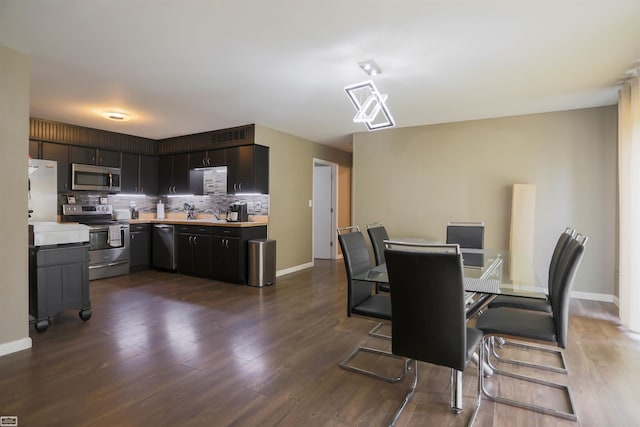 dining area with dark hardwood / wood-style floors