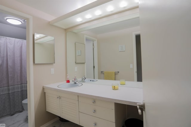 bathroom with vanity and toilet